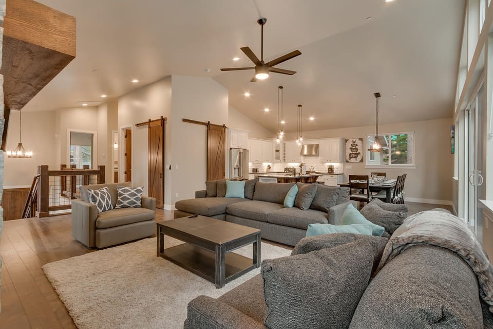 - Spacious living area open plan  
- Barn doors add rustic charm  
- Tahoe Airbnb with stylish design