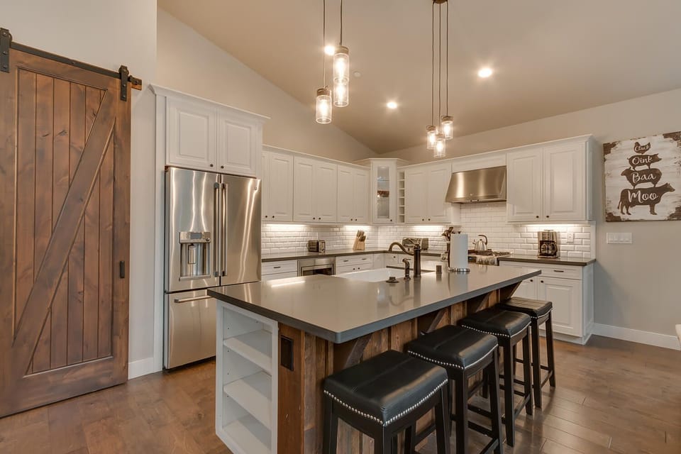 - Modern kitchen with island seating  
- Stainless steel appliances ready  
- Airbnb home with chef's kitchen