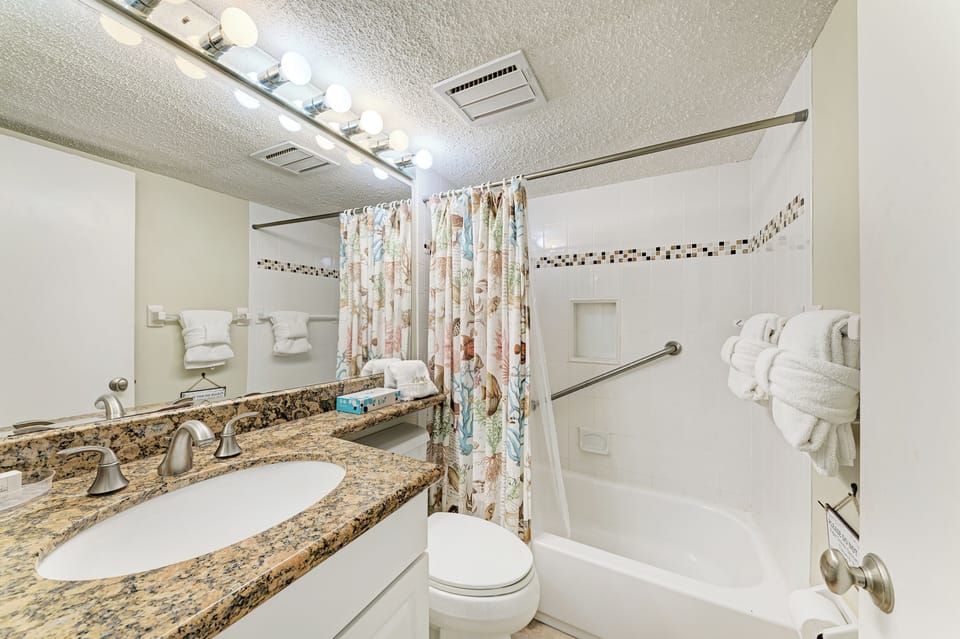 Guest bathroom with tub/shower.