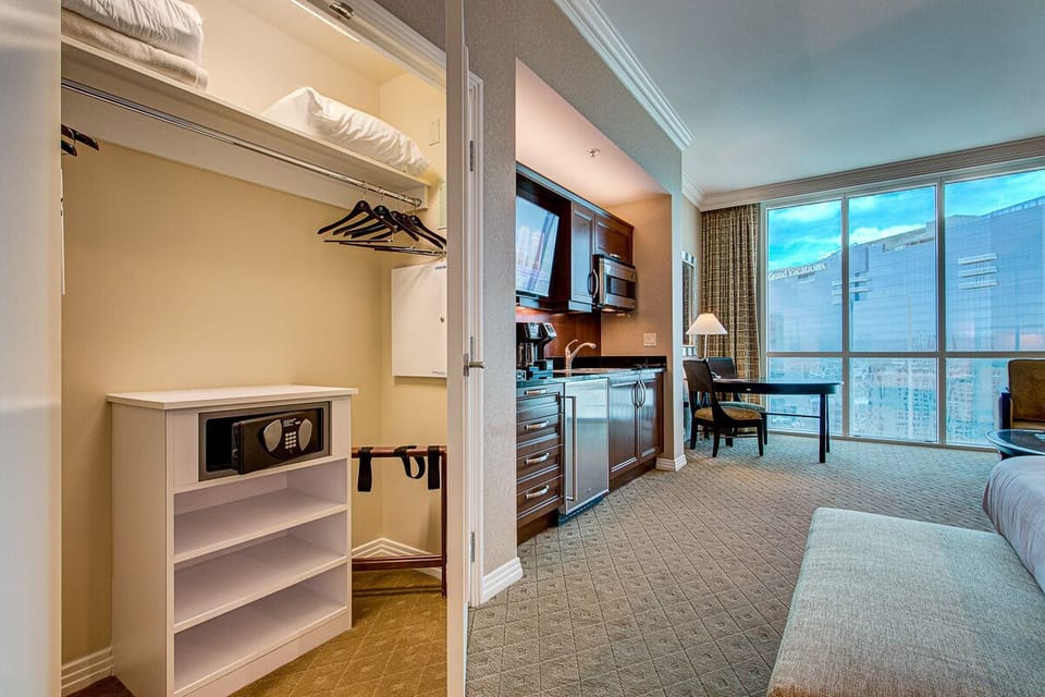 Left side of suite features safe and kitchenette.