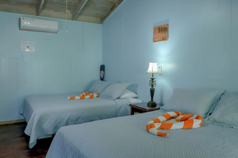 Basic Room, 2 Queen Beds, Sea View | Pillowtop beds, bed sheets