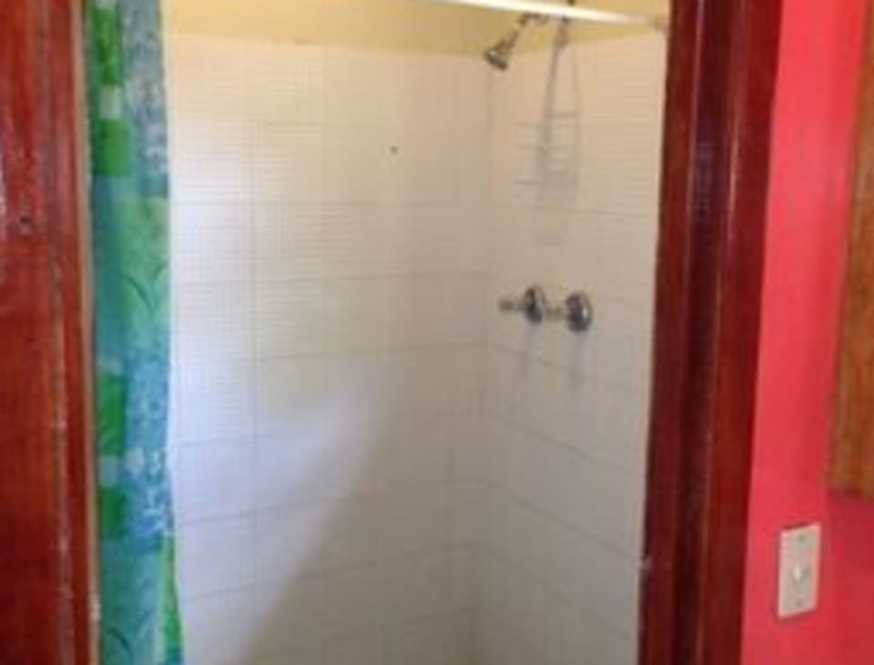 Basic Room, 2 Queen Beds, Sea View | Bathroom | Shower, rainfall showerhead, towels, soap