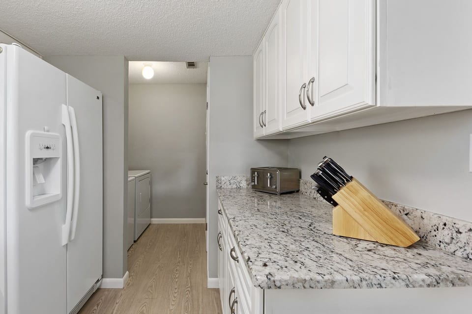 washer and dryer off of the kitchen