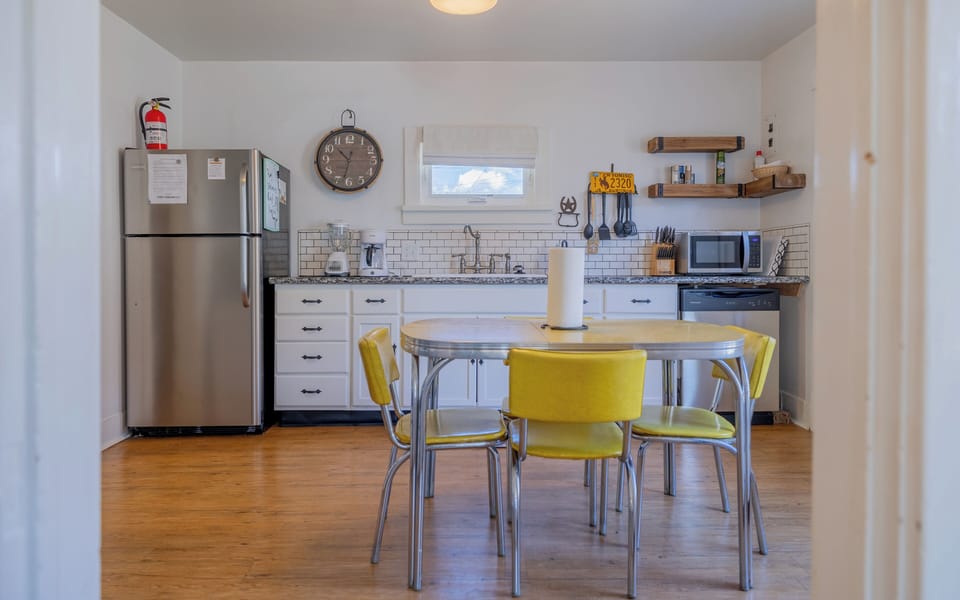 The bright, open kitchen with eat in dining space is a great place to gather for meals or morning coffee