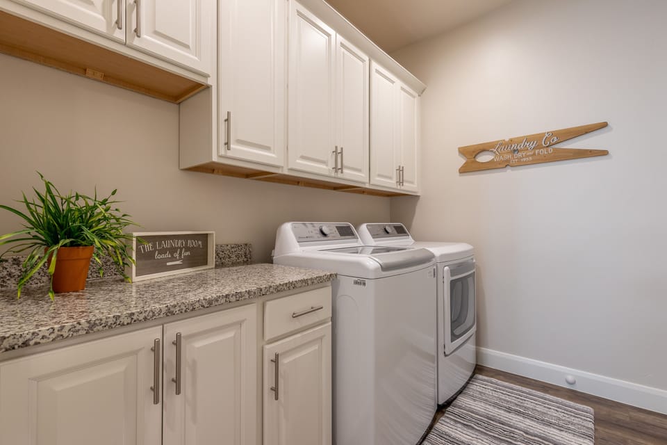 Laundry Room - The laundry room has a washer, dryer, iron, ironing board and is stocked with laundry detergent if you desire to wash your clothes during your stay.