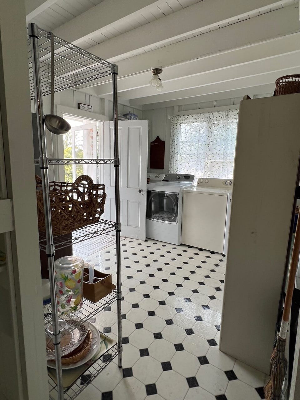 2 washers & dryers, small porch with clothes line & a second French door frig.