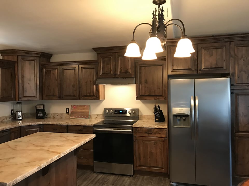 Kitchen view of stove and Fridge