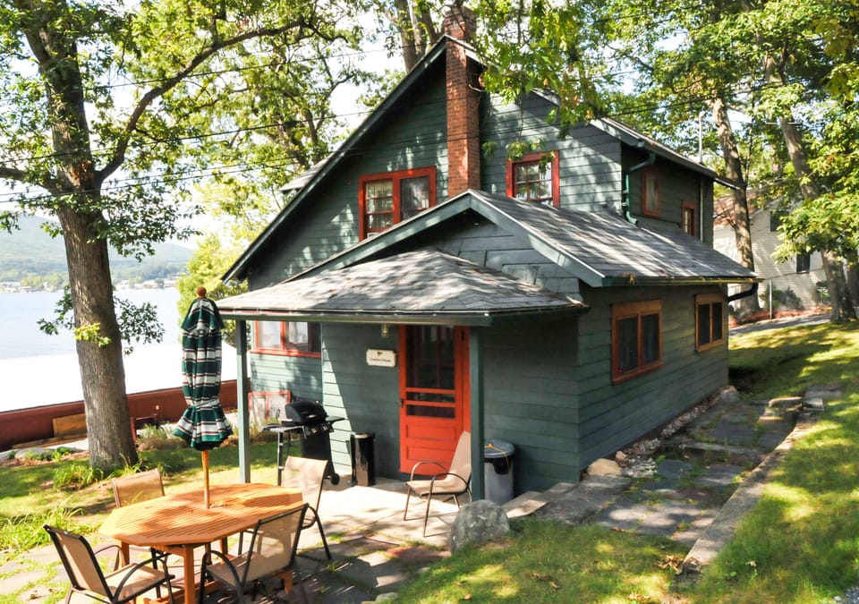 Side entrance to Crawford. BBQ grill, fire pit, and patio are near this space.