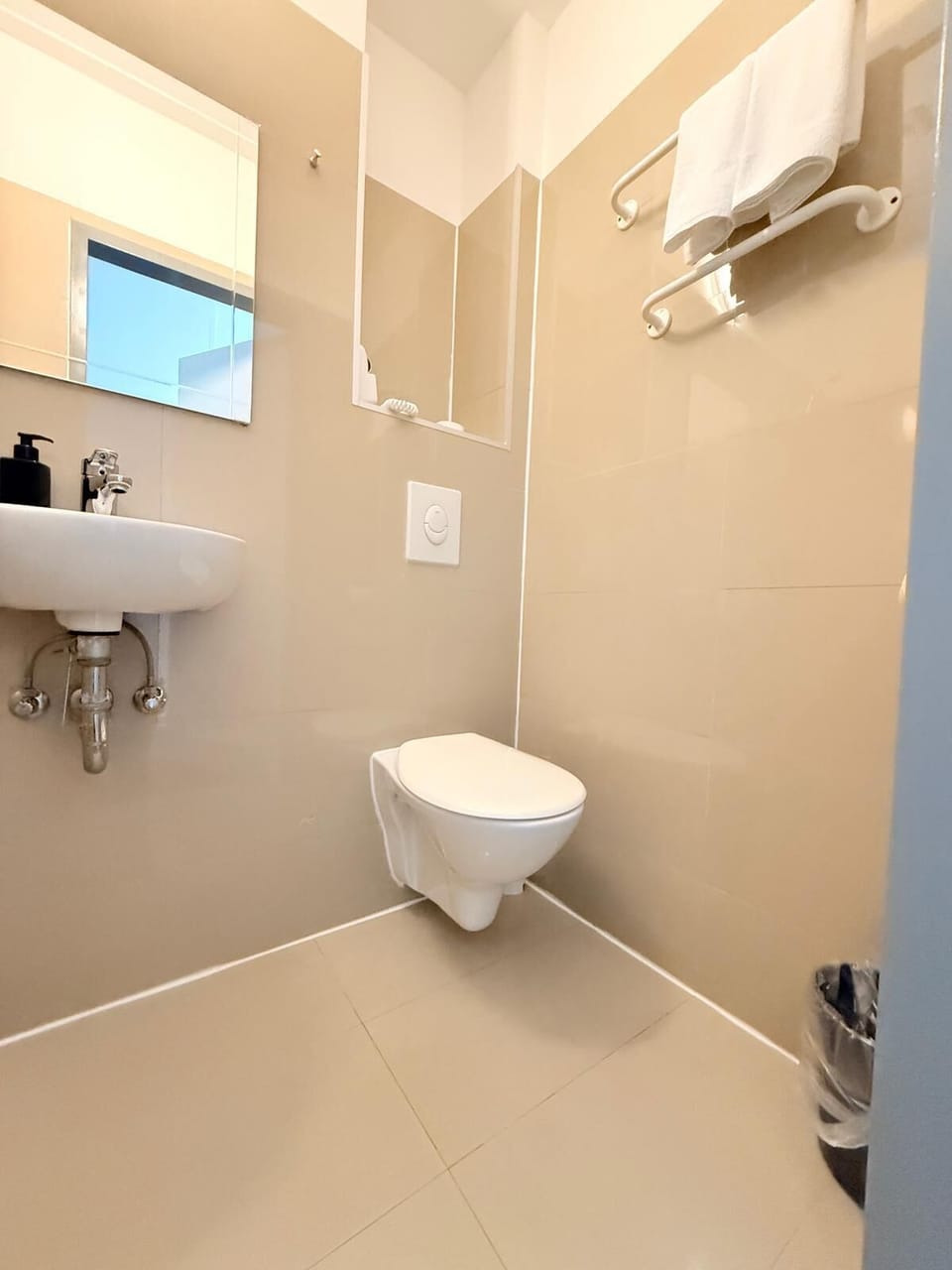 Shower, rainfall showerhead, towels, toilet paper