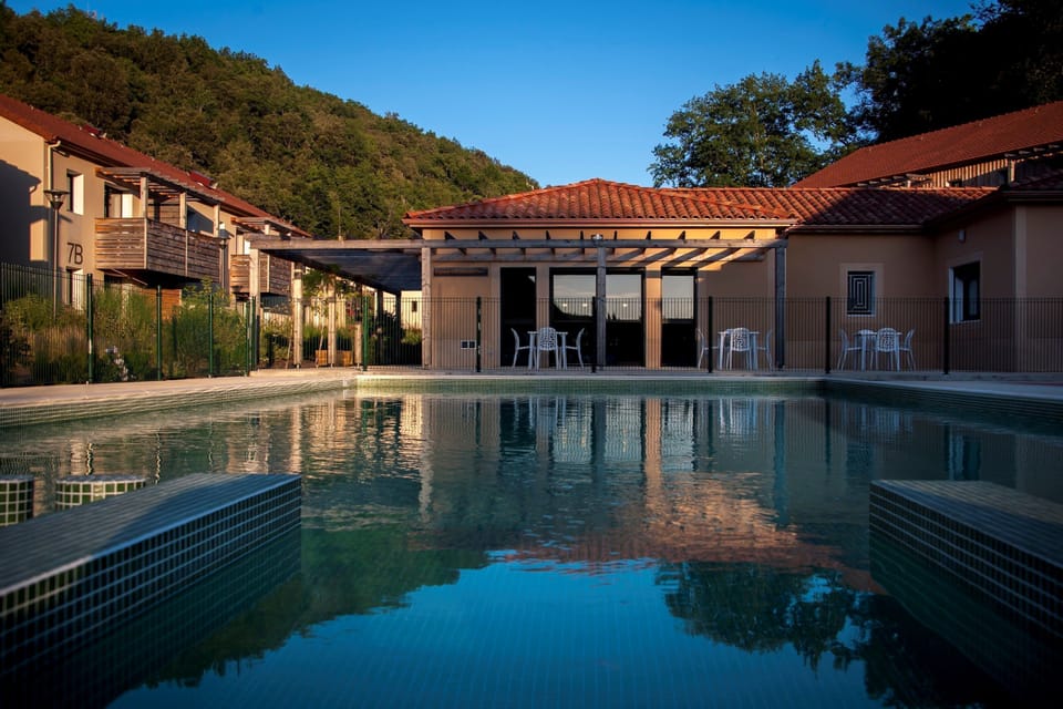 Dive into tranquility with a refreshing swim surrounded by lush scenery and contemporary design.