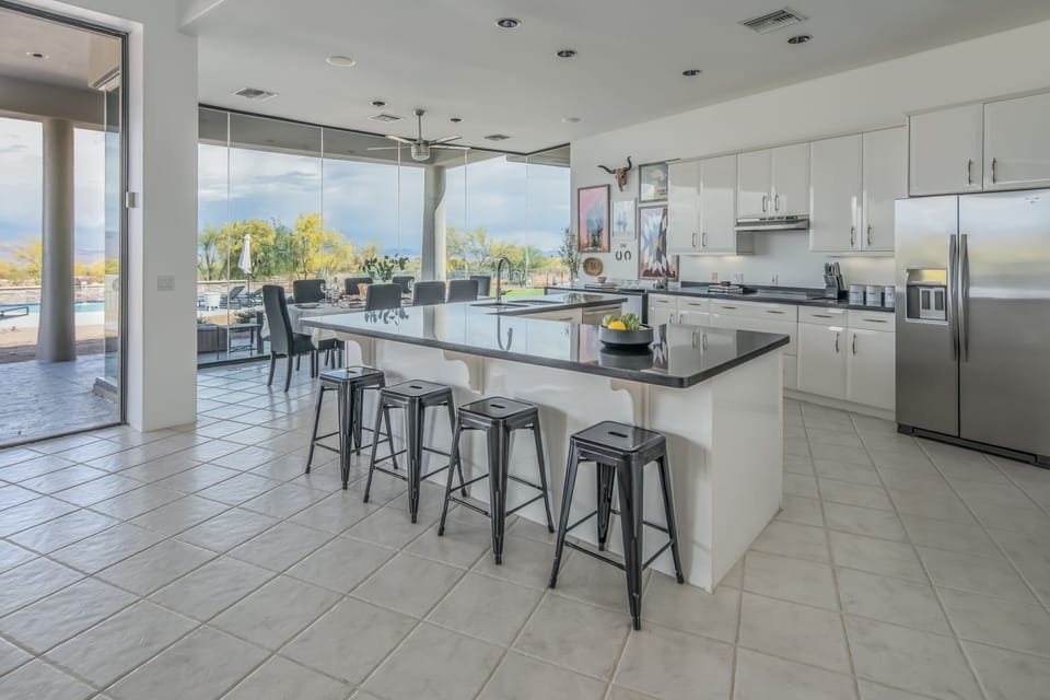 Kitchen. Grab a stool, food is coming.