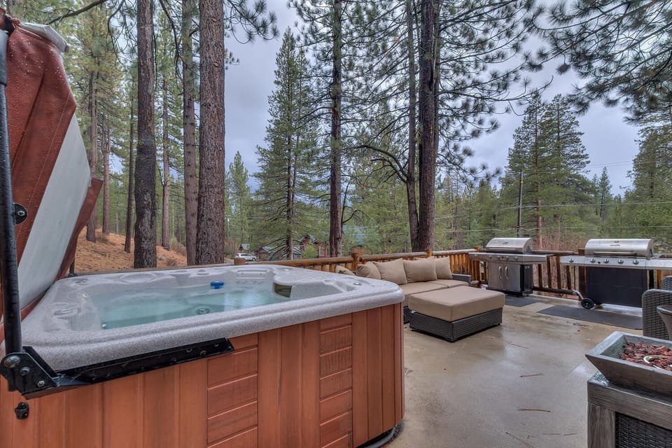 - Private hot tub on deck with forest views  
- Cozy outdoor seating perfect for gatherings  
- Lake Tahoe cabin rental with hot tub and grill space