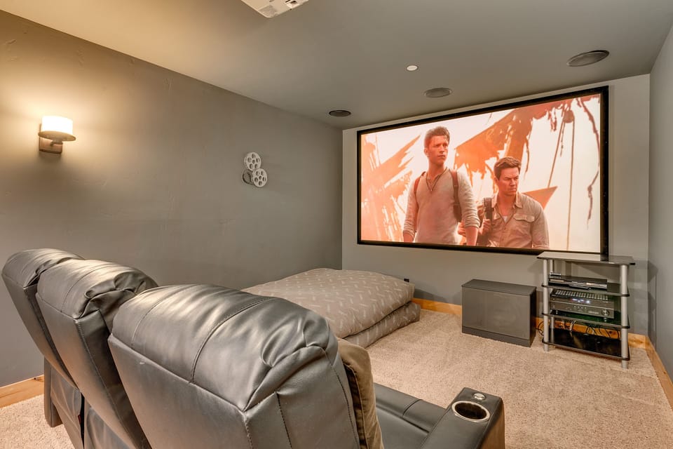 - Private theater room with big screen projector  
- Reclining chairs and cozy setup for movie nights  
- Tahoe vacation rental with home cinema experience