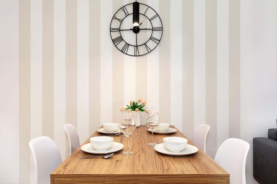 A close-up of the dining area with simple decor, emphasizing the spaciousness and contemporary feel.