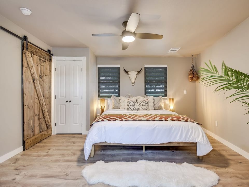 Lodge Bedroom A.  Full bathroom behind the barn door.