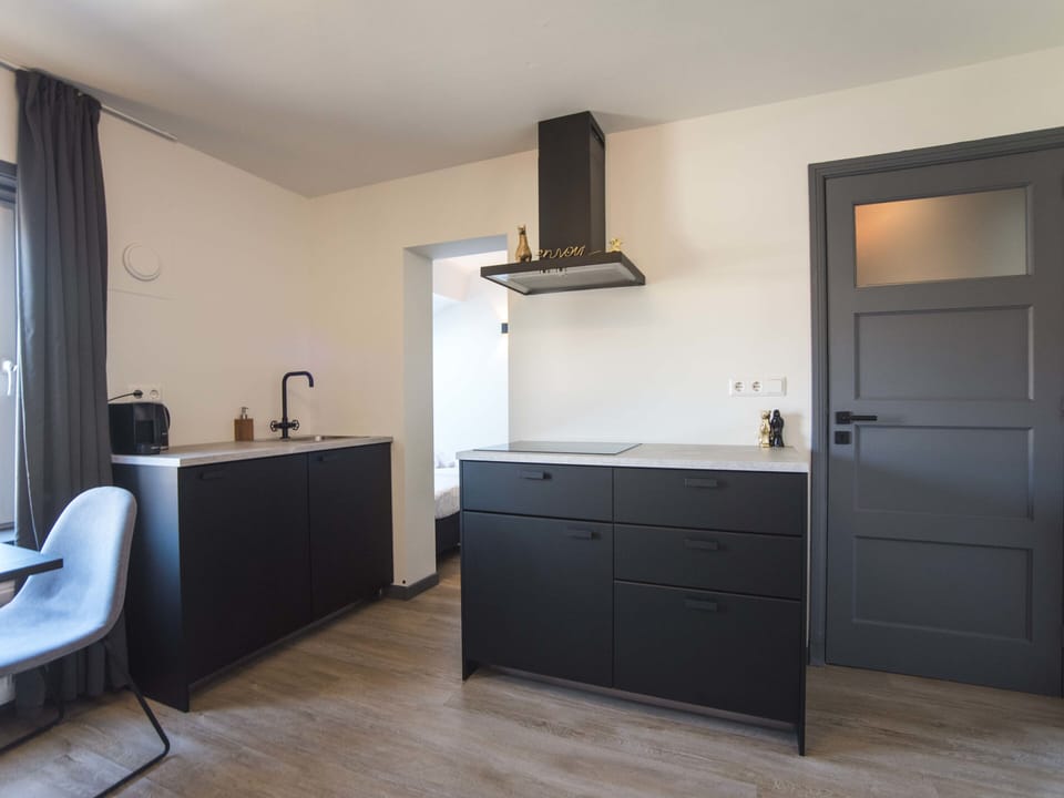 Fully equipped kitchen with fridge, freezer, microwave and a Nespresso machine