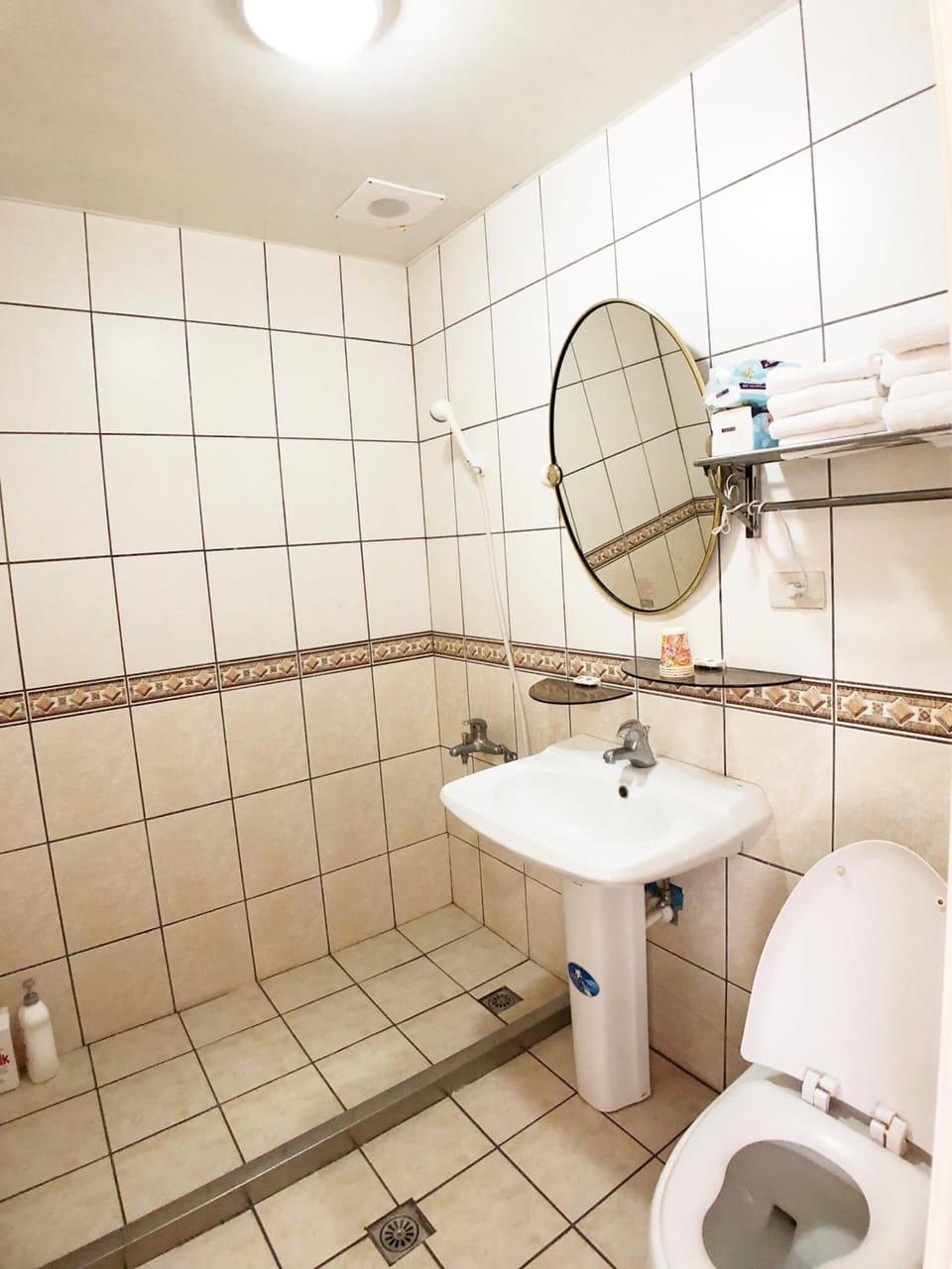 Shower, free toiletries, slippers, towels