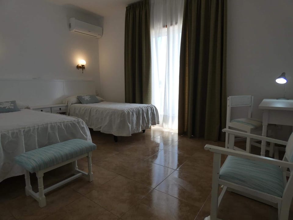 Desk, blackout drapes, WiFi (free), bed sheets