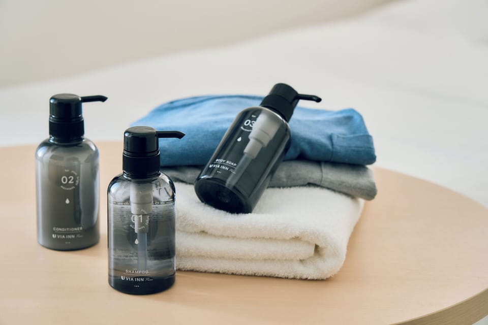 Eco-friendly toiletries, hair dryer, slippers, electronic bidet