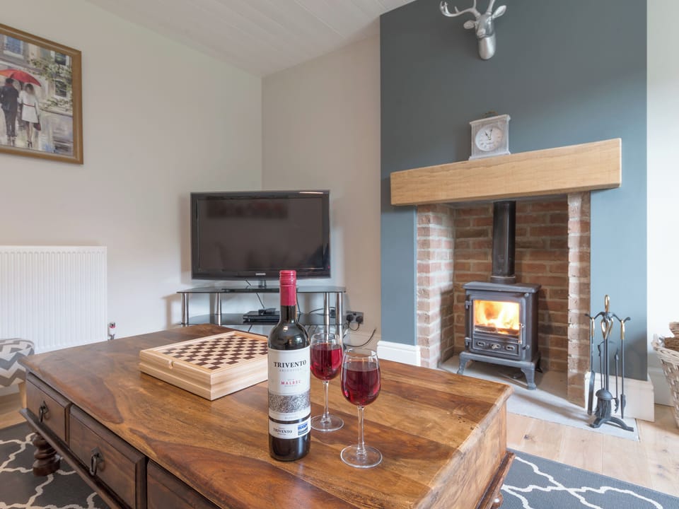 Inviting living room with wood burner | Abraham&rsquo;s Cottage, Langthwaite, near Richmond