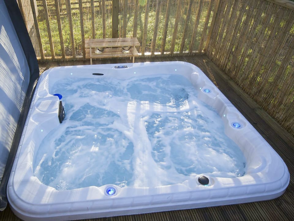 Relax in the private hot tub | The Hideaway, Otterburn, near Bellingham