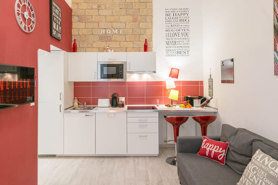 Design Apartment, 1 Queen Bed with Sofa bed (RED) | Private kitchen | Fridge, microwave, stovetop, dishwasher