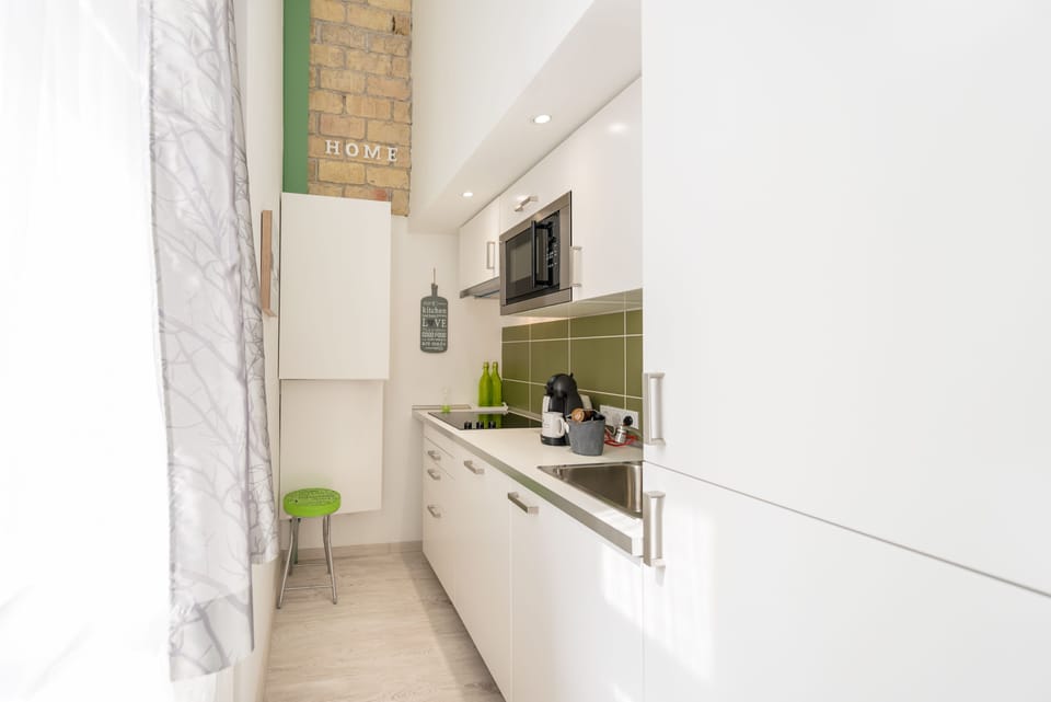 Design Apartment, 1 Queen Bed with Sofa bed (GREEN) | Private kitchen | Fridge, microwave, stovetop, dishwasher