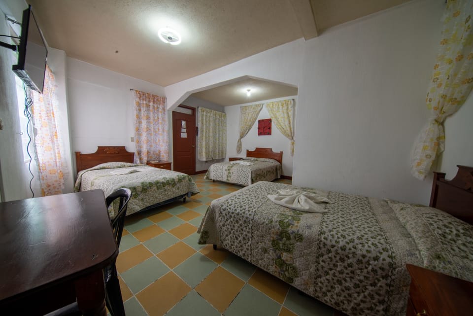 Standard Triple Room, Mountain View | 4 bedrooms, down comforters, blackout drapes