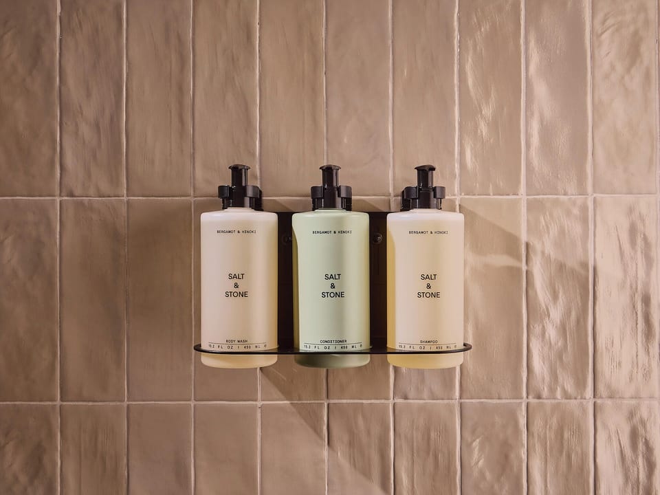 Shower, rainfall showerhead, designer toiletries, hair dryer