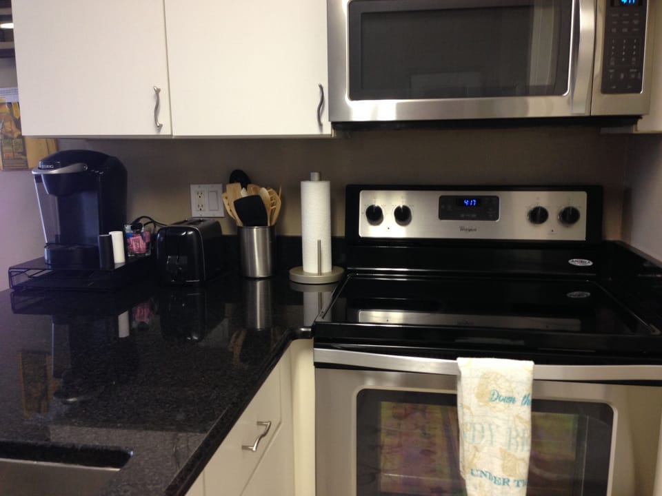 Granite counters, stainless stove/microwave & Keurig coffee maker. 