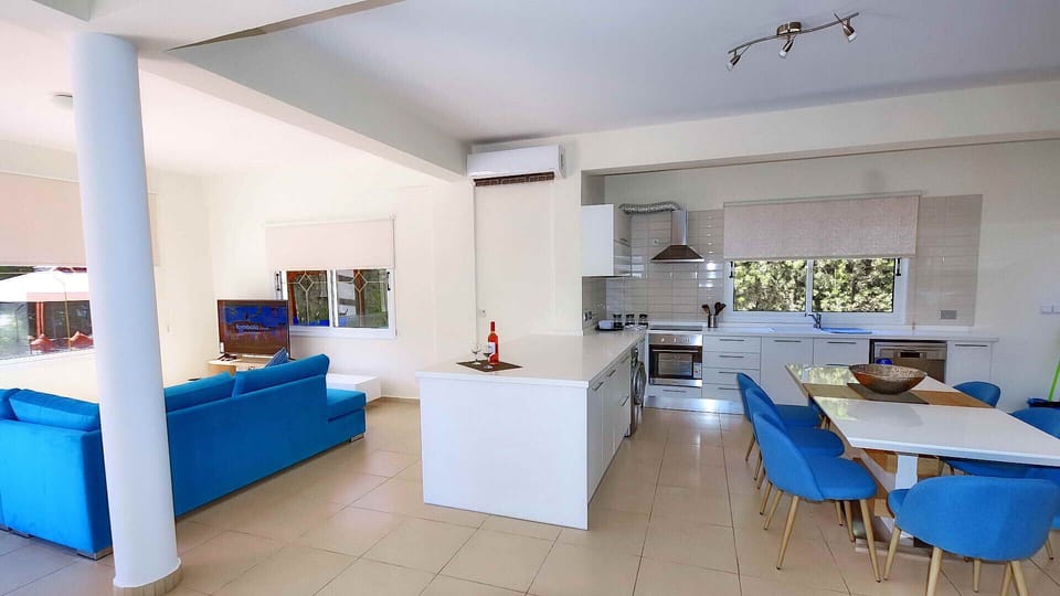 Open plan kitchen lounge and dining areas are air conditioned.