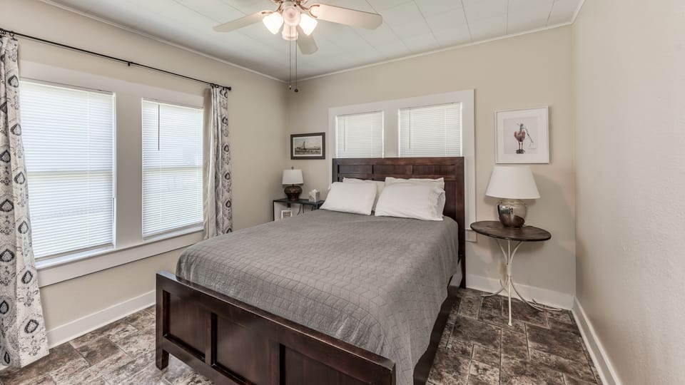 Master bedroom has Queen Beauty Rest mattress, Ceiling fan, & attached bathroom.