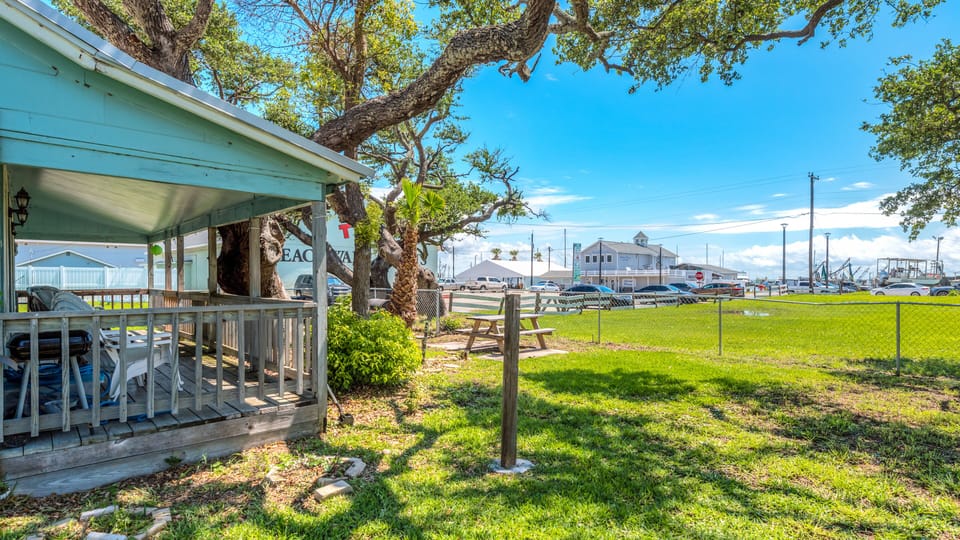 House has outside picnic table, two charcoal grills and Hammock.  