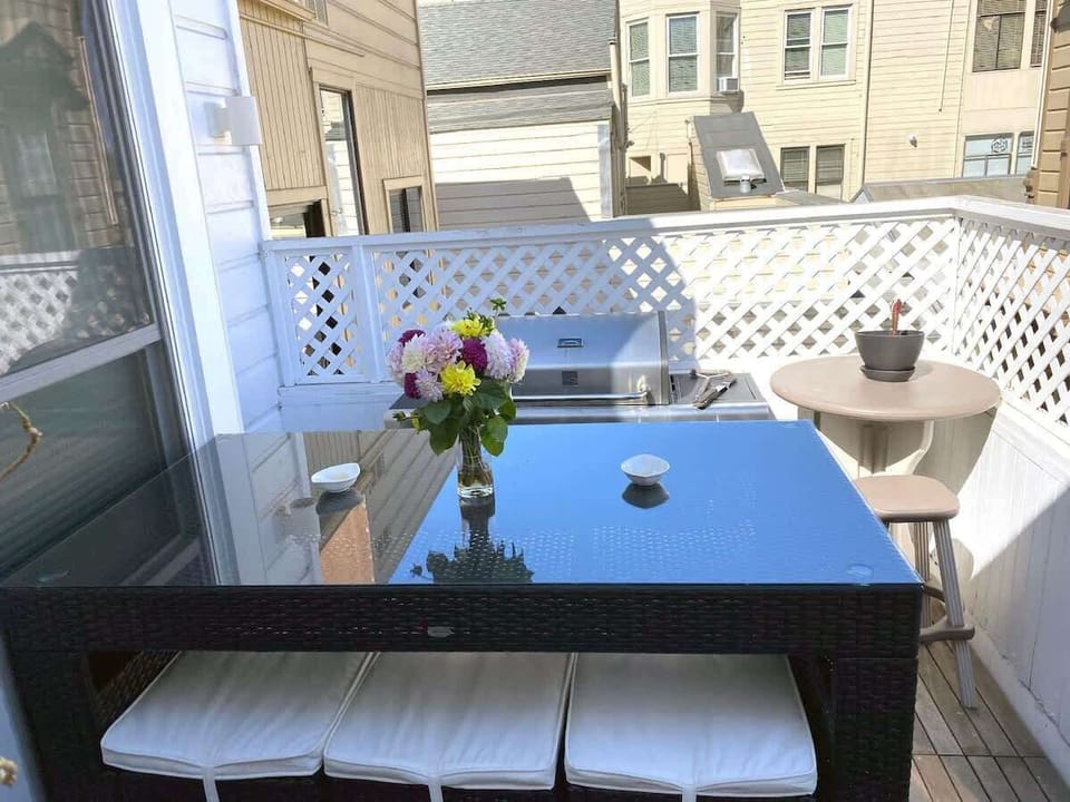 Outdoor terrace with BBQ grill seats 6... perfect for enjoying  warm days/evenings.  There's a slight view of downtown if you look hard enough...