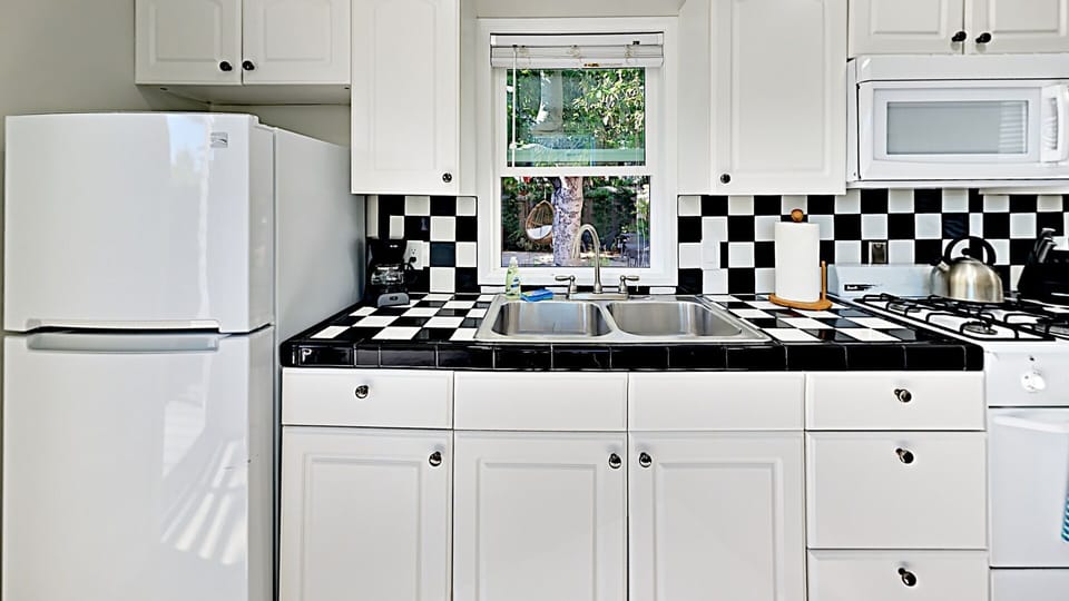 Cute Kitchen with all the tools you need to make your own home cooked meals, plenty of storage and counter space.