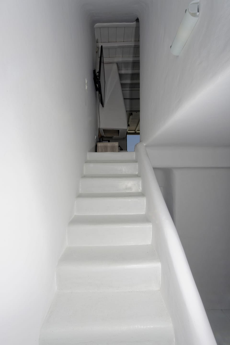 Stairs connecting the three levels of the villa
