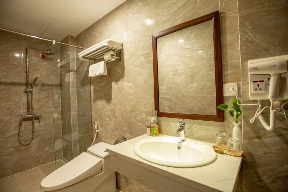 Shower, free toiletries, hair dryer, slippers