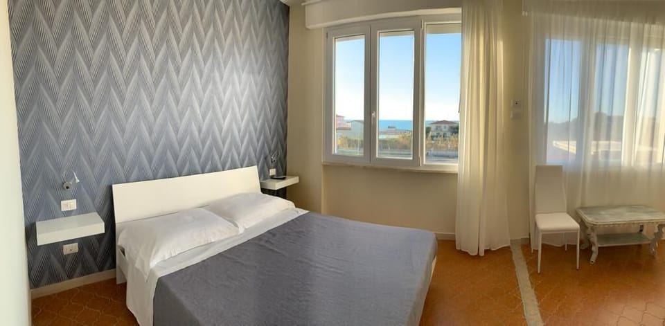 Superior Triple Room, Sea View | Soundproofing, iron/ironing board, bed sheets