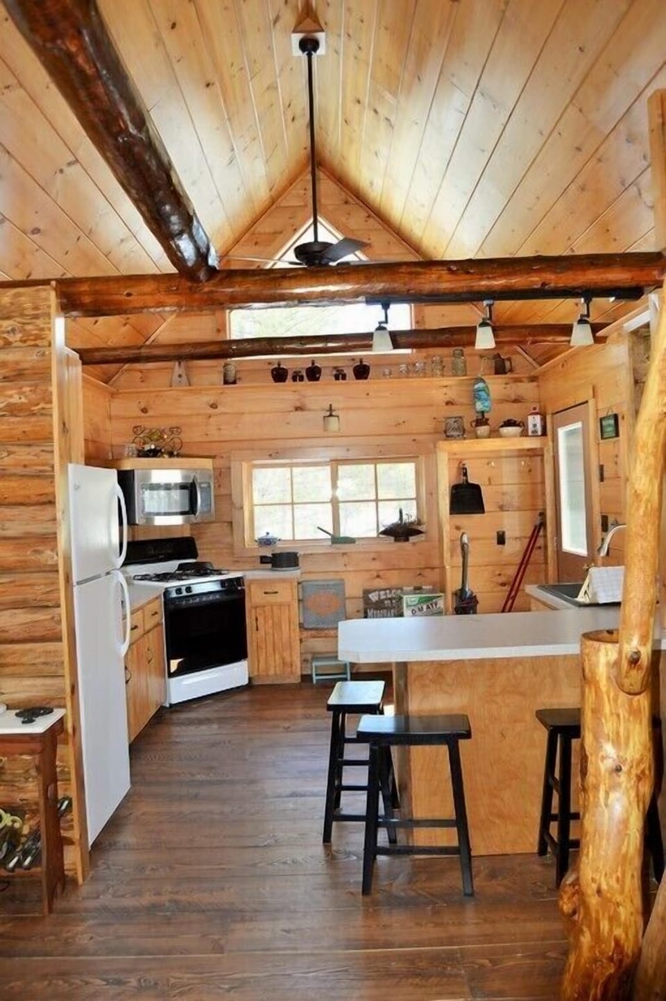 view of bar seating and kitchen from the living room