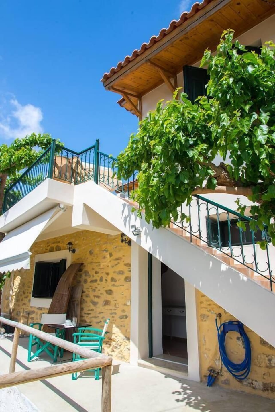 The stairs lead to the top floor terrace and main house