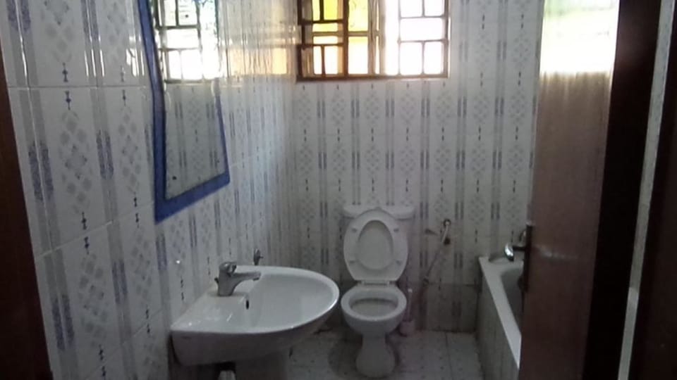 Separate tub and shower, towels, soap, toilet paper