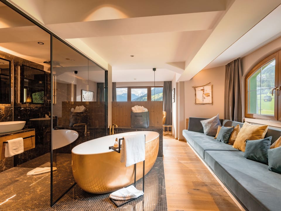 Exclusive Suite | Living area | 46-inch flat-screen TV with satellite channels, foosball, books