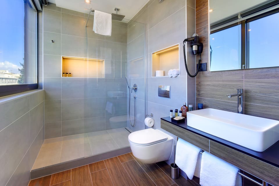 Deluxe Double or Twin Room, City View | Bathroom | Hair dryer, slippers, towels, soap