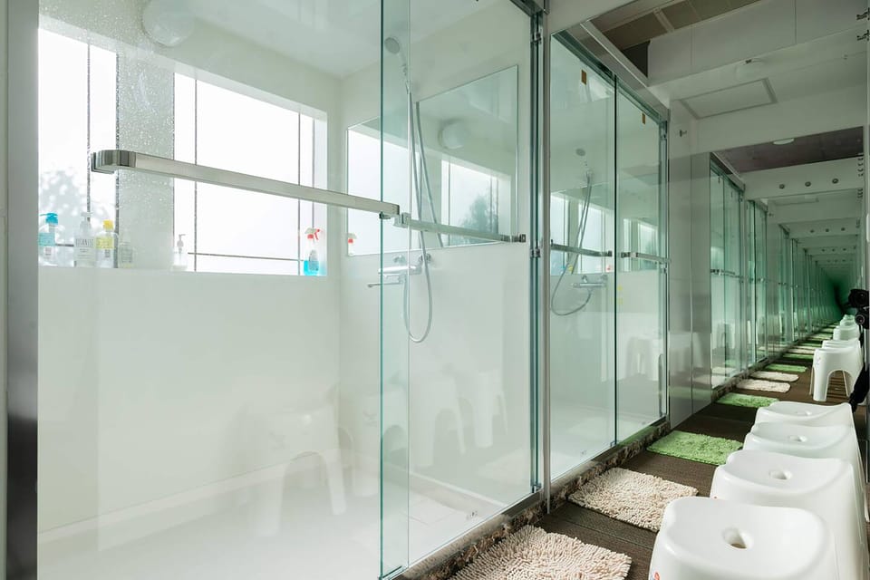 Shower, eco-friendly toiletries, hair dryer, slippers