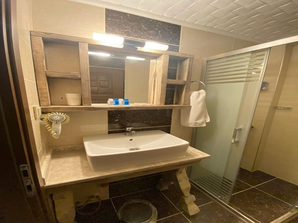 Standard Room, Balcony, Partial Sea View | Bathroom | Shower, rainfall showerhead, hair dryer, slippers