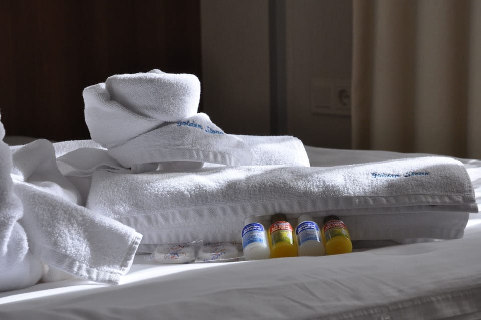 Deluxe Room, Sea View | Bathroom amenities | Shower, rainfall showerhead, hair dryer, slippers