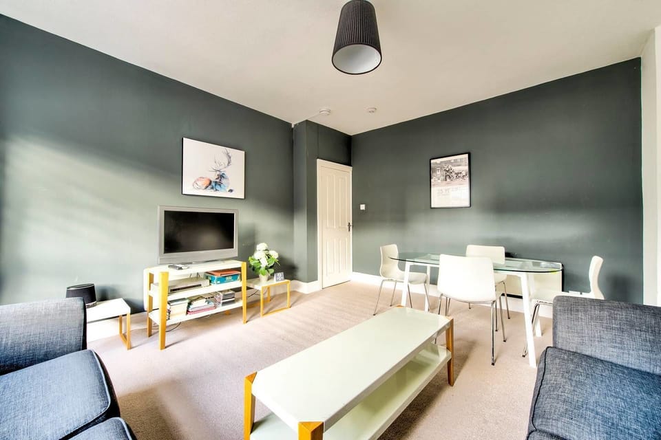 Apartment (1 Bedroom) | Living room | 24-inch flat-screen TV with cable channels