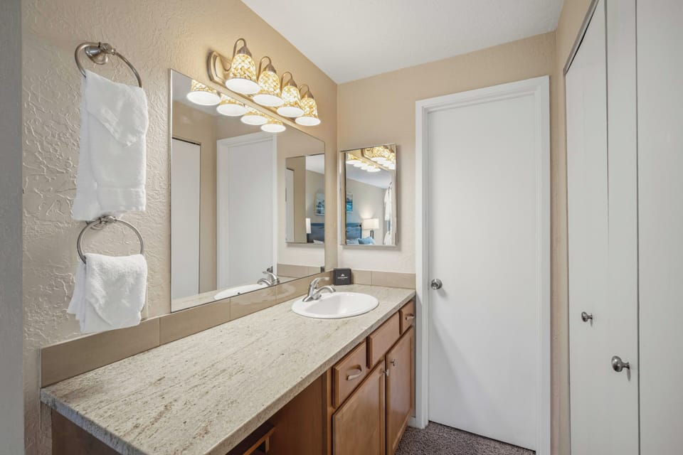 Refresh in your private bathroom with plenty of counter space, soft lighting, and plush towels waiting for you after a long day of exploring.