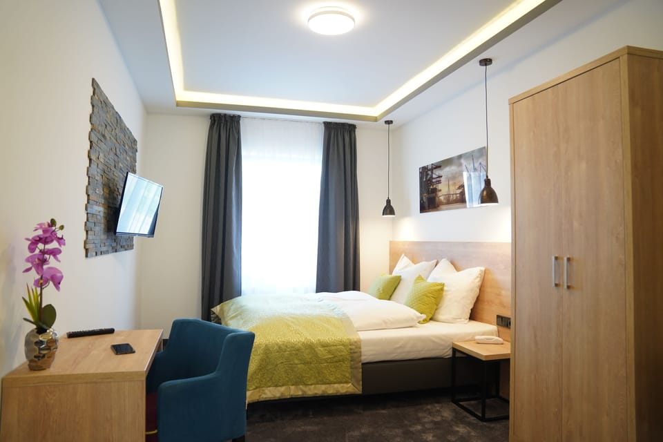 Double or Twin Room | Down comforters, desk, laptop workspace, blackout drapes