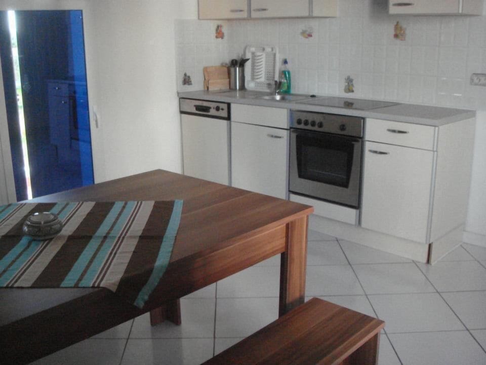 Fridge, stovetop, electric kettle, cookware/dishes/utensils